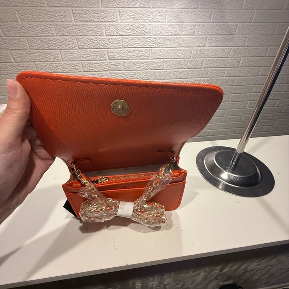 Bebe Orange Embossed Clutch with Metallic Logo - Picture 3 of 3